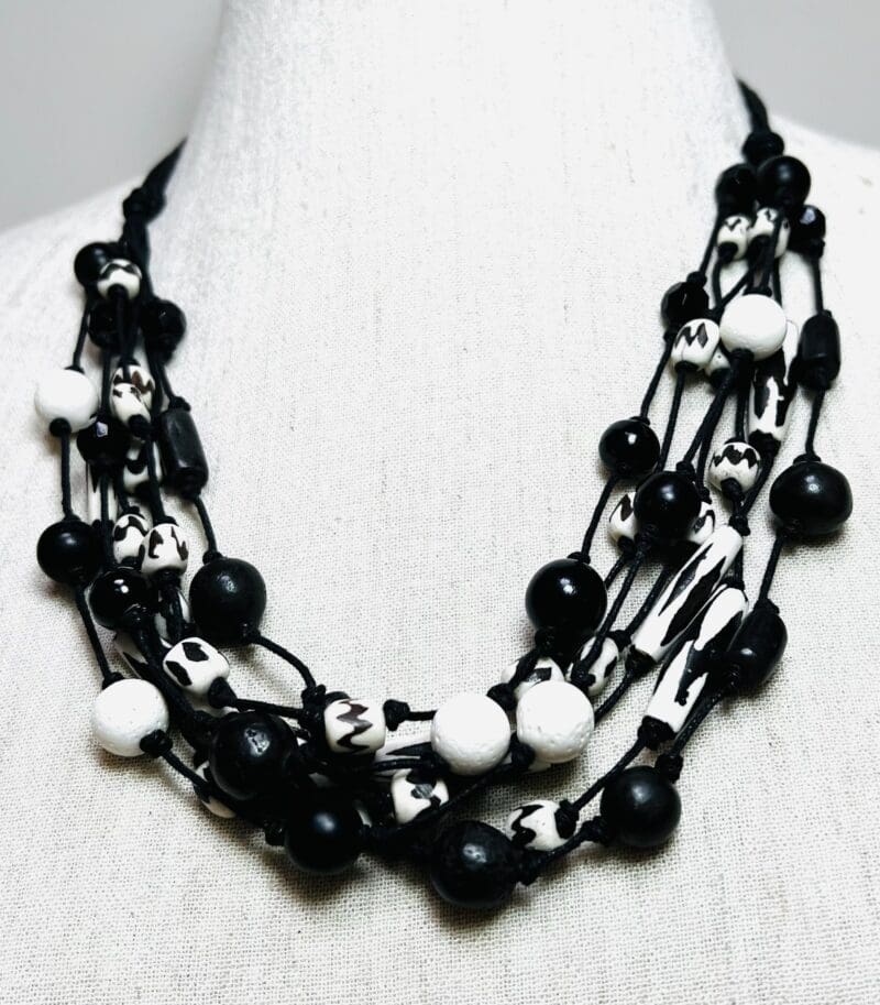 Cream/black pattern bone bead 7-strand necklace on black string (N-418)