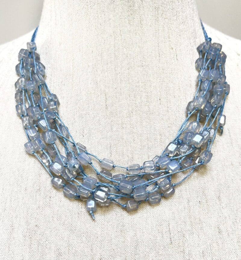 Moonstone beads 10-strand necklace on light blue string (N-431)