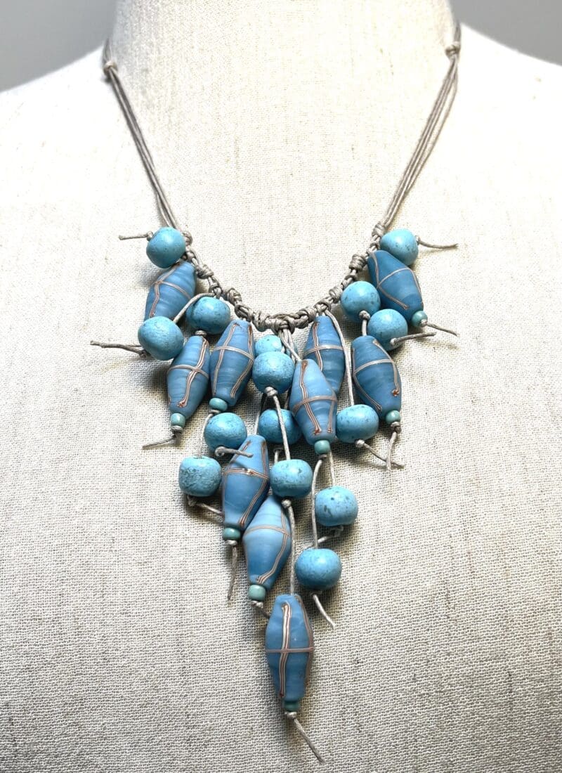 Light blue Moroccan and Java cross beads dangle necklace on taupe string (N-442)
