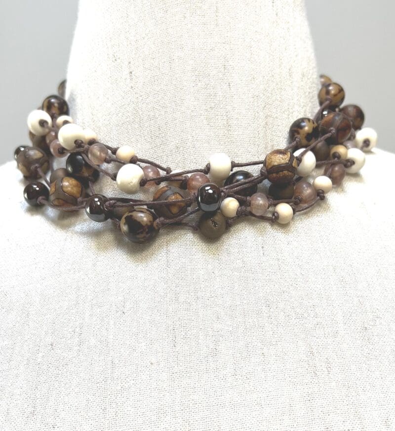A variety of cream and fancy brown beads 7-strand necklace on brown string (N-446) - Image 2