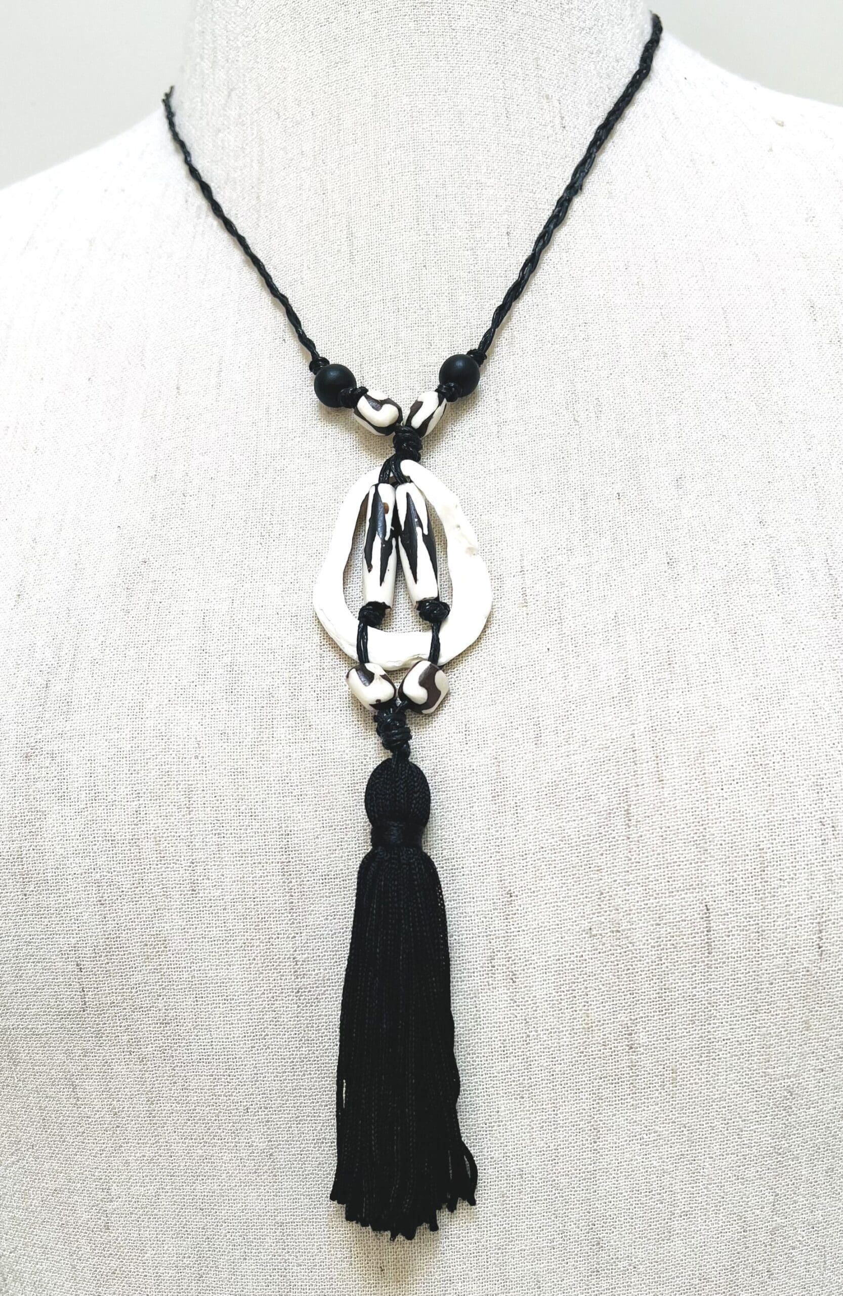 Shell piece, black and white African beads and black tassel drop necklace (N-460)